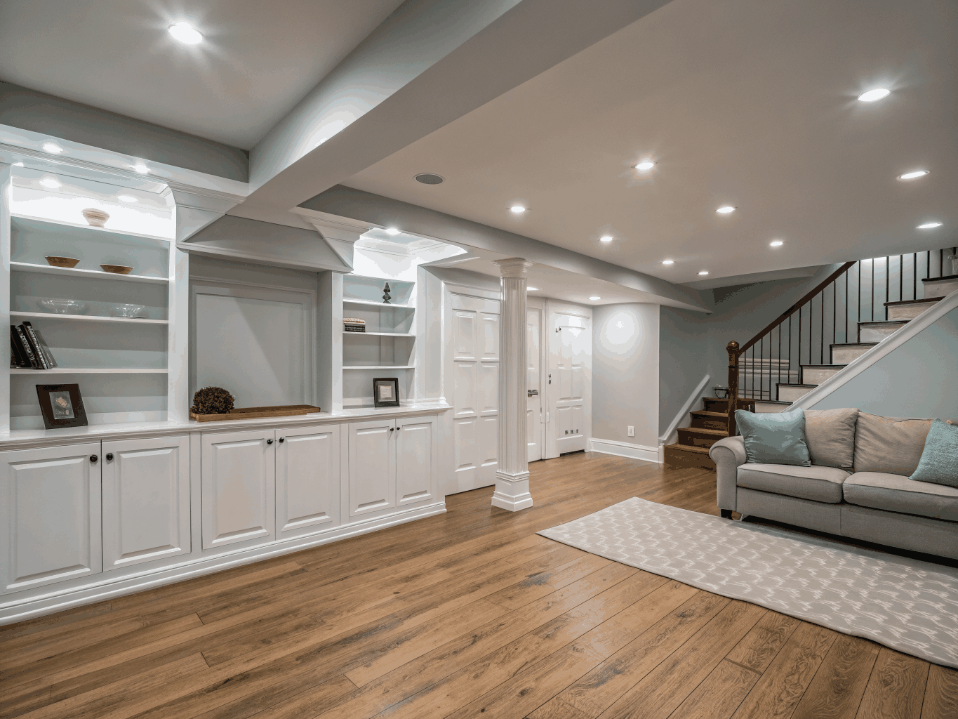 Finished walkout basement remodel with contemporary entertainment lounge