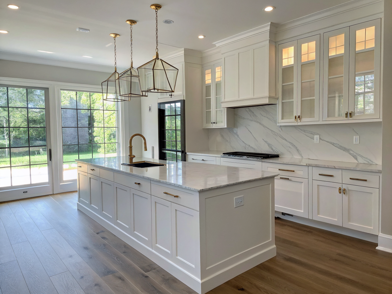 Custom kitchen renovation in Kennesaw featuring white oak cabinetry and quartz island